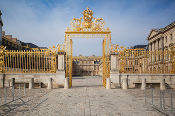 Grand Golden Entrance Gates to Palace of Versailles in France on a Sunny Summer Day