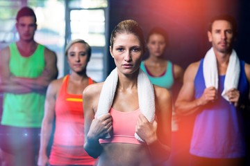 Portrait of serious young friends in gym