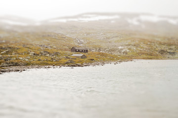 Landscape of Norway, mountains and shed, view from train