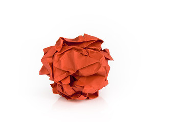 Red colored paper ball isolated on white background. Picture taken in studio with soft-box.