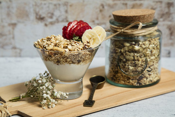 Granola served with yogurt, fruits and honey