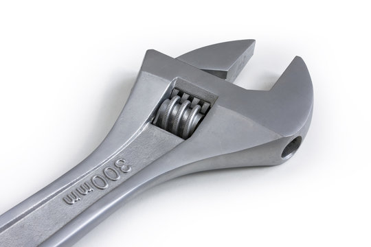 Monkey wrench isolated on white background. Still-life picture taken in studio with soft-box.