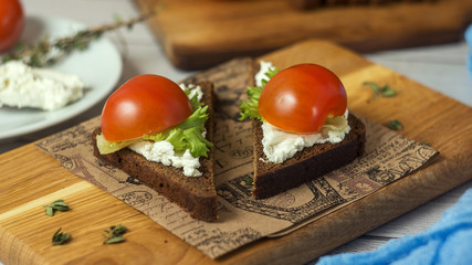 Healthy Snacks Sandwiches with goat cheese, salad, cherry tomatoes