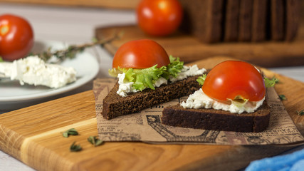 Healthy Snacks Sandwiches with goat cheese, salad, cherry tomatoes