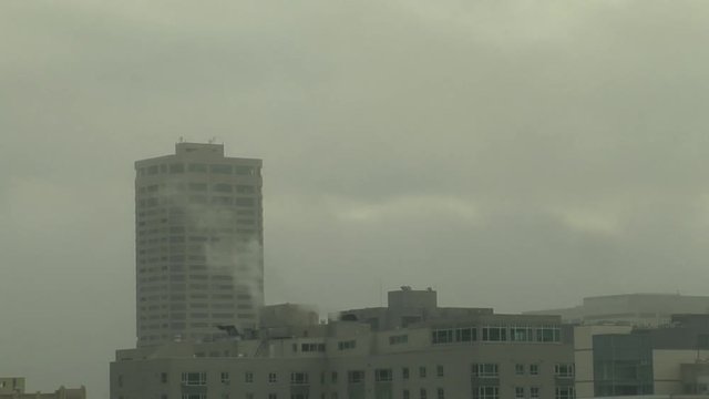 Seattle Fog Bank Swirls Around Buildings