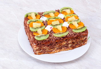 Delicious homemade cake with chocolate and fruits