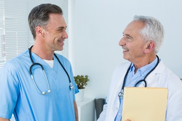 Surgeon and doctor interacting with each other