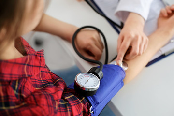 Doctor measuring blood pressure