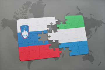 puzzle with the national flag of slovenia and sierra leone on a world map