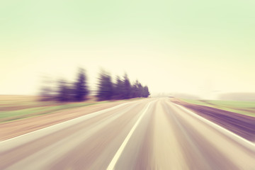 Motion blurred road in vintage color.