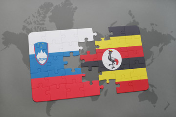 puzzle with the national flag of slovenia and uganda on a world map © luzitanija