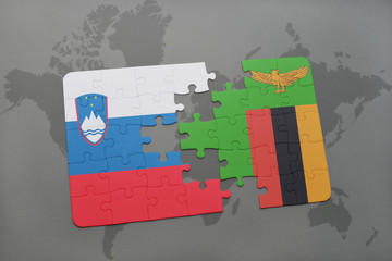 puzzle with the national flag of slovenia and zambia on a world map
