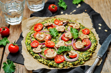 Kale oats pizza crust with tomato, red onion and mushrooms