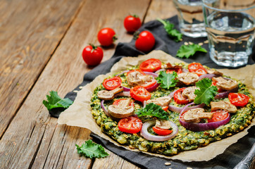 Kale oats pizza crust with tomato, red onion and mushrooms