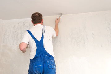 Hands plasterer at work
