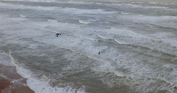 Drone shot of a guy kiting in Amsterdam, Netherlands, slow