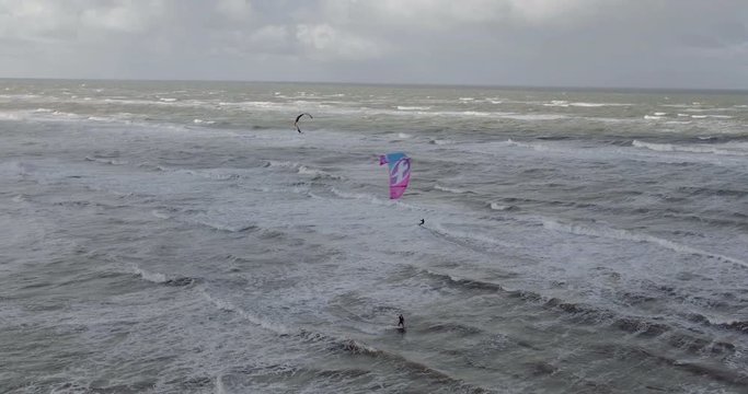 Drone shot of a guy kiting in Amsterdam, Netherlands, wide