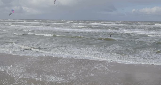 Drone shot of a guy kiting in Amsterdam, Netherlands, flip