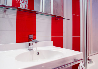 Bright bathroom interior in red and white colors