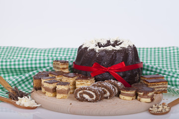Tasty chocolate cake on a wooden base