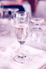 glass of champagne on the table, light toning