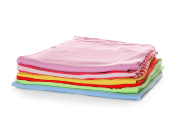 Stack of colorful clothes on white background, closeup