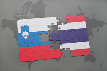 puzzle with the national flag of slovenia and thailand on a world map