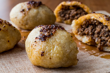 icli kofte / Boiled kibbeh / Quibe with butter sauce.