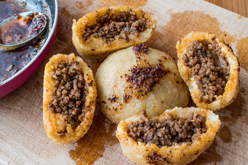 icli kofte / Boiled kibbeh / Quibe with butter sauce.