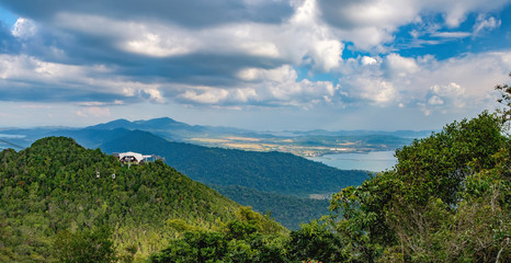 Fototapeta na wymiar Panoramic view of blue sky, sea and mountain seen from Cable Car viewpoint, Langkawi Island, Malaysia. Langkawi SkyCab is one of the major attractions in the island