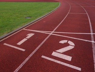 Number one and number two, red rubber running racetrack