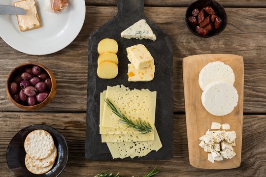 Cheese, olives, biscuits and rosemary herbs 