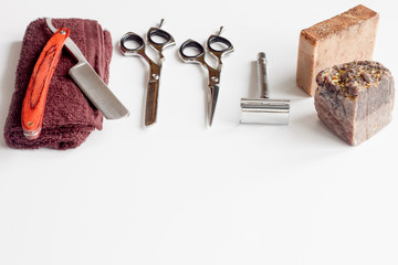 white desktop with tools for shaving beards