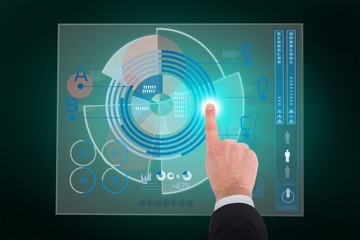 Composite image of businessman touching invisible screen