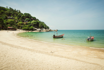 Fototapeta na wymiar beautiful tropical beach with boats