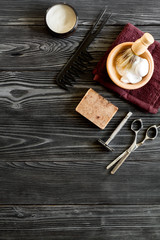 Fototapeta na wymiar Tools for cutting beard barbershop top view on wooden background