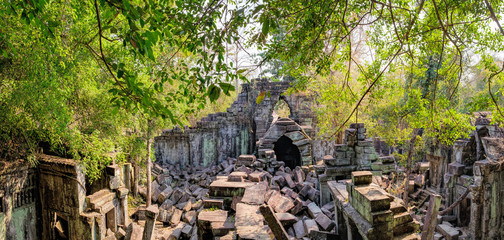 Prasat Beng Mealea in Angkor Complex, Siem Reap, Cambodia. It is largely unrestored, old trees and brush growing amidst towers and many of its stones lying in great heaps. Ancient Khmer architecture.