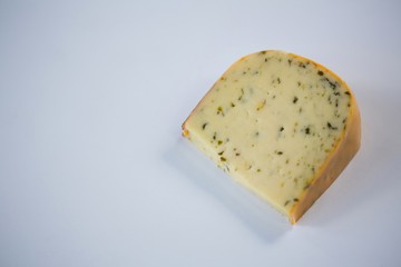 Piece of cheese on white background