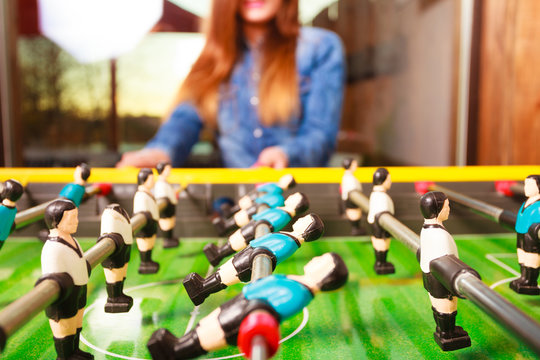woman playing table football game