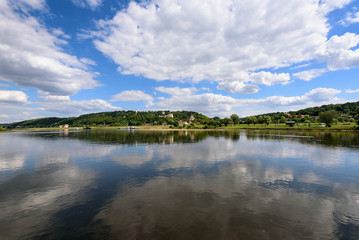 Landscape of beautiful Vistula river at summer day. Reflections of clouds in water. Poland. Kazimierz Dolny, Poland
