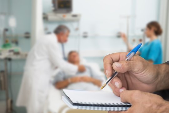 Composite image of doctor checking patient with stethoscope