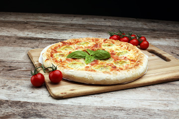 Hot true PEPPERONI ITALIAN PIZZA with salami and cheese. TOP VIEW Tasty traditional pepperoni pizza on board on wooden table with decoration