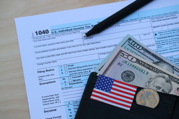 Tax form, Dollar cash in wallet, finance accounting and tax season concept