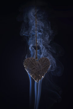decorative valentines day heart in smoke on black background