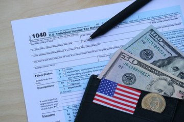 Tax form, Dollar cash in wallet, finance accounting and tax season concept