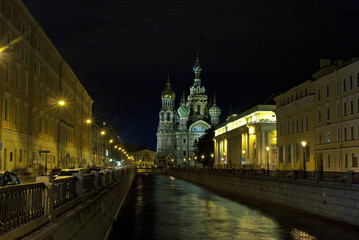 Fototapeta premium Night city view. Church, river and street