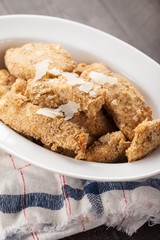 Oven Baked Parmesan Crusted Chicken Tenders on a red white and blue napkin