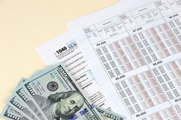 Obraz premium tax calculation form with USD dollar cash
