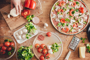 Woman slicing mozzarella cheese