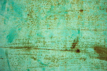 The old metal blue wall with rust.